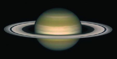 Planet Saturn and its rings. One can assume that a black hole accretion disc, although made of hot gas instead of rocks and ice, has a similar shape, namely circular thin rings.