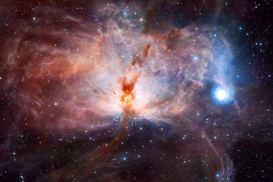 Nébuleuse de la Flamme, région d'étoiles en formation dans la constellation d'Orion, à 1500 années-lumière. Photo ESO